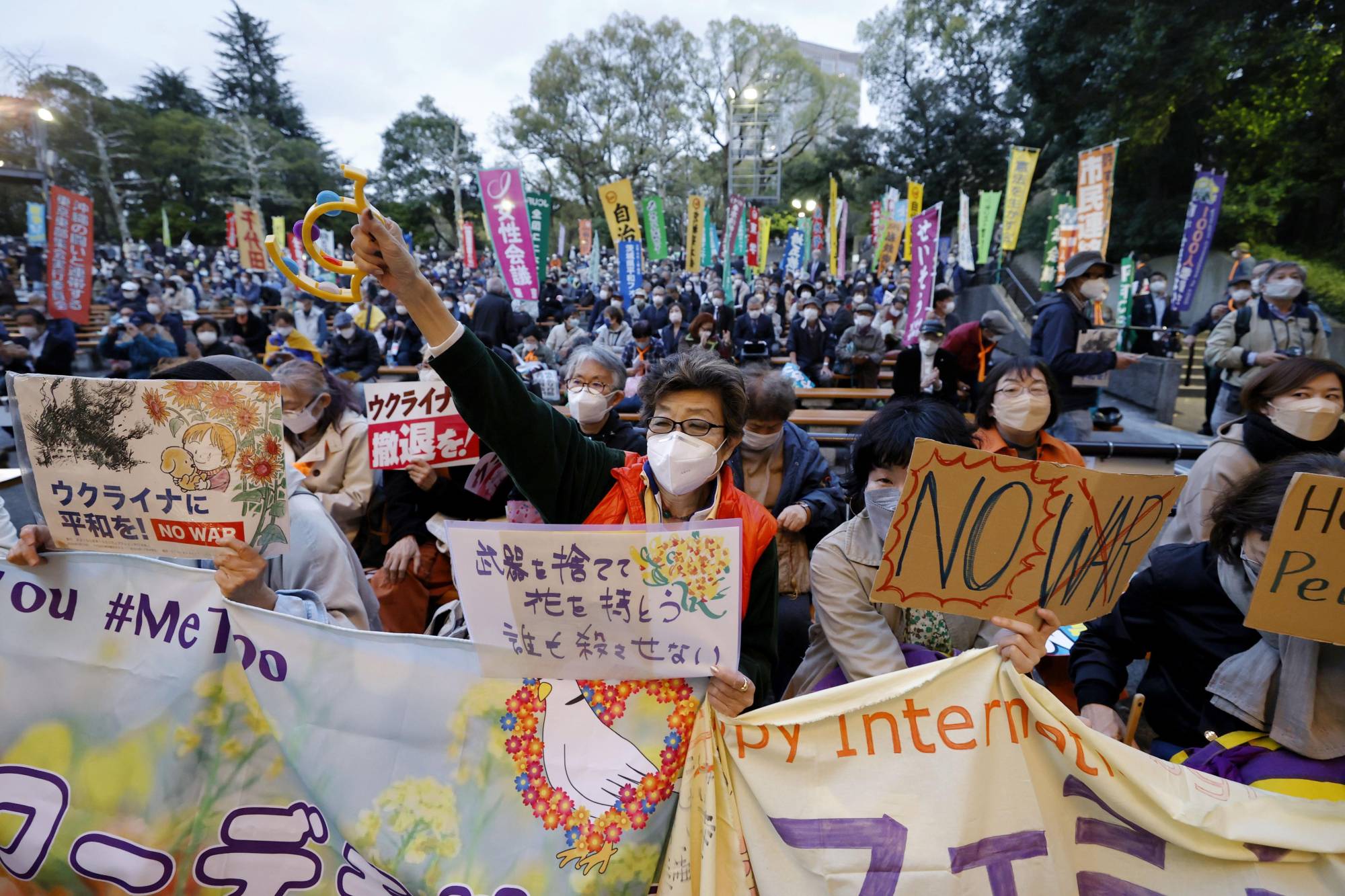 A protest against Russia's invasion of Ukraine in Tokyo's Hibiya Park on Friday.  | KYODO