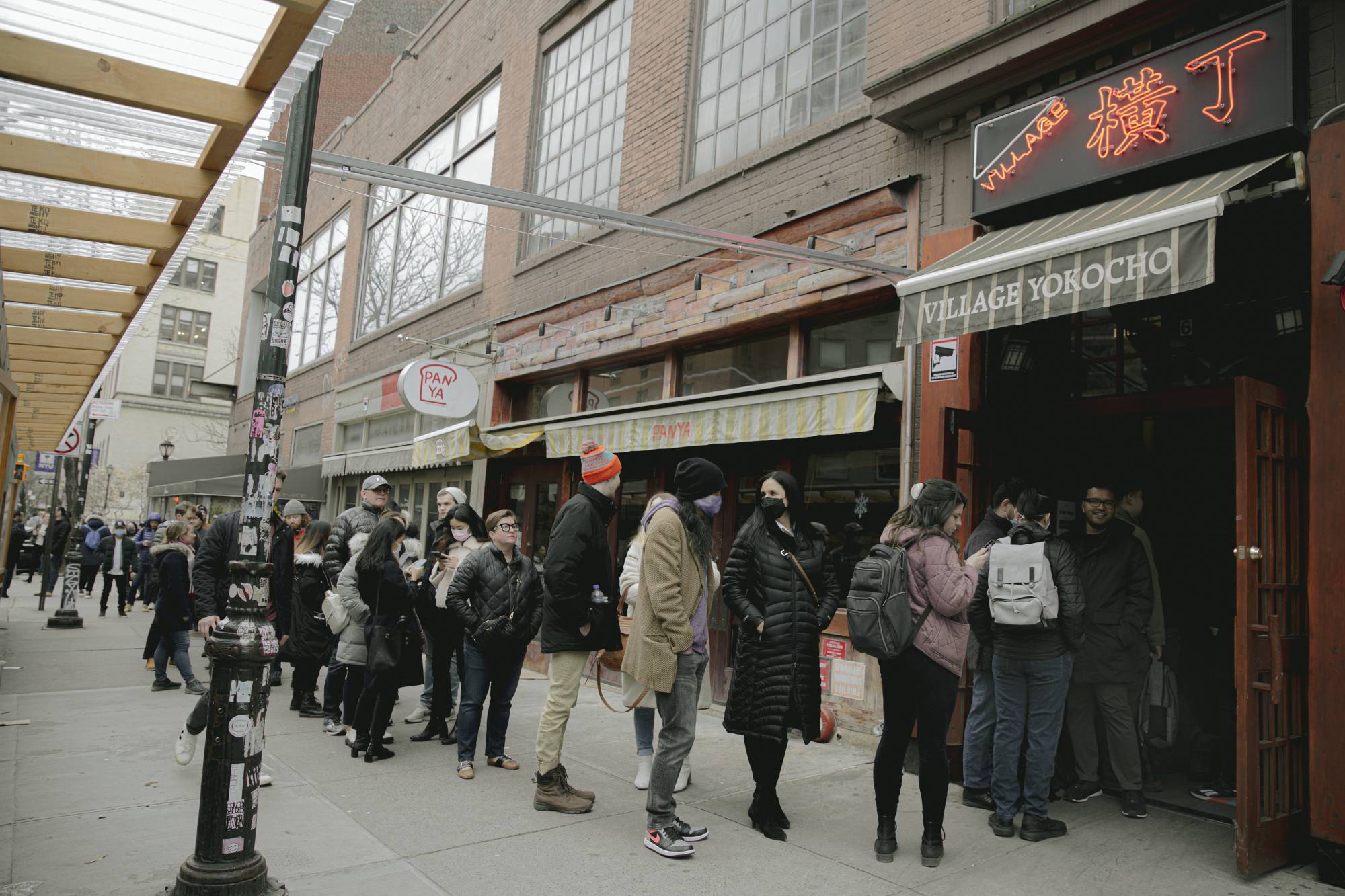 People line up around the block to dine at Angel's Share and Village Yokocho on one of their final nights before closing in the East Village in Manhattan on March 31. | Haruka Sakaguchi / The New York Times