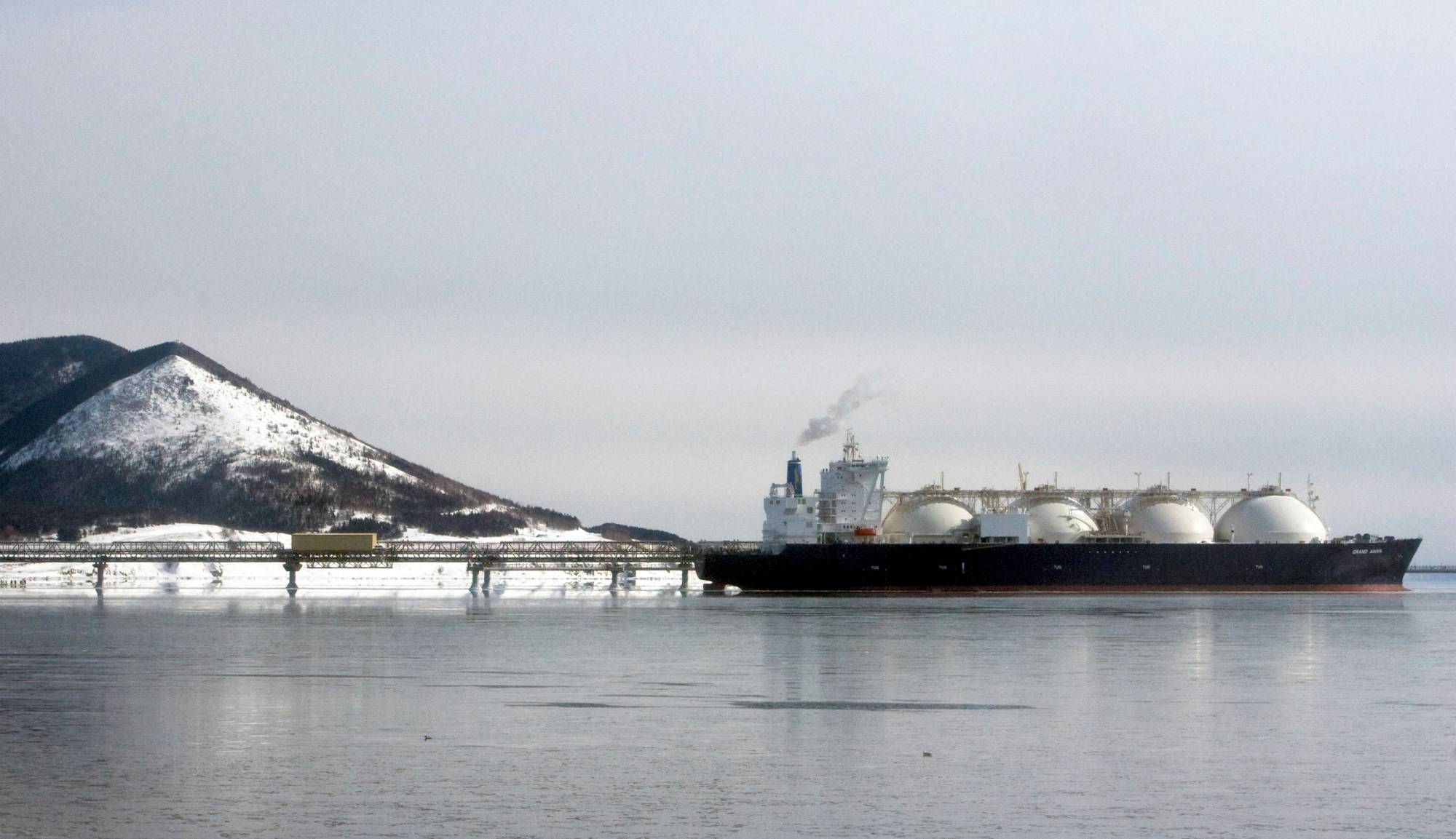 A Japanese-made liquefied natural gas (LNG) carrier is anchored near an LNG plant on Sakhalin island, Russia, in February 2009. | REUTERS