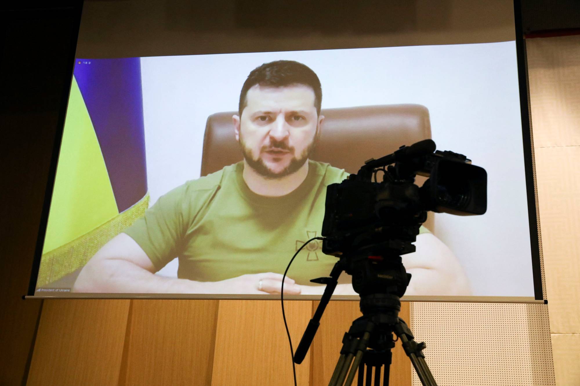 Ukrainian President Volodymyr Zelenskyy addresses South Korean parliament via video link at the National Assembly in Seoul on Monday. | POOL / VIA REUTERS