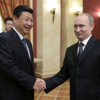 Chinese leader Xi Jinping and Russian President Vladimir Putin in Sochi, Russia, in 2014 | RIA NOVOSTI / KREMLIN / VIA REUTERS 