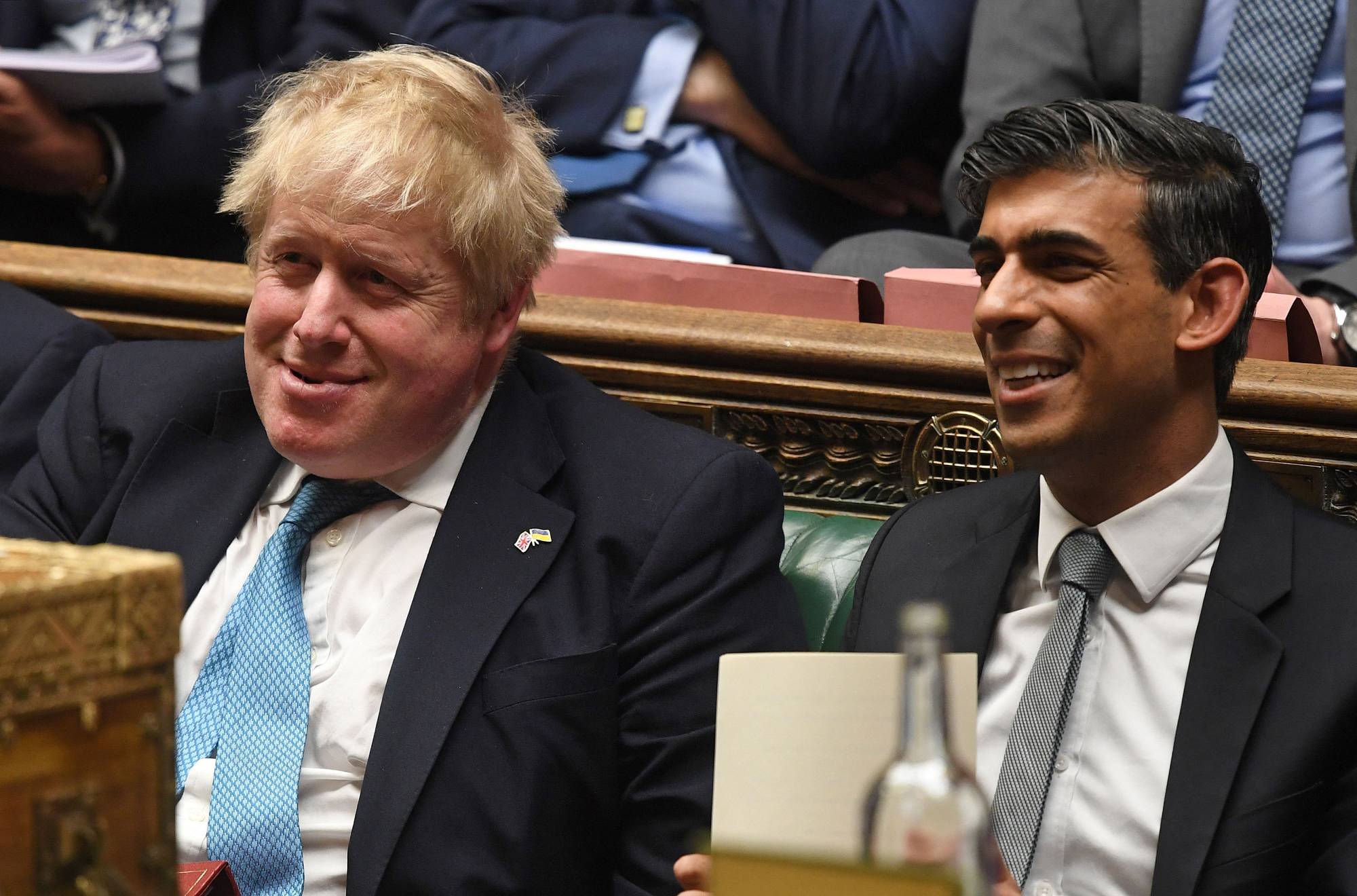 U.K. Prime Minister Boris Johnson and Chancellor of the Exchequer Rishi Sunak at the House of Commons in London in March.  | UK PARLIAMENT / VIA AFP-JIJI