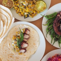Earthy toasted corn salad and fresh octopus blend in this recipe perfect for warm weather. | SIMON DALY      
