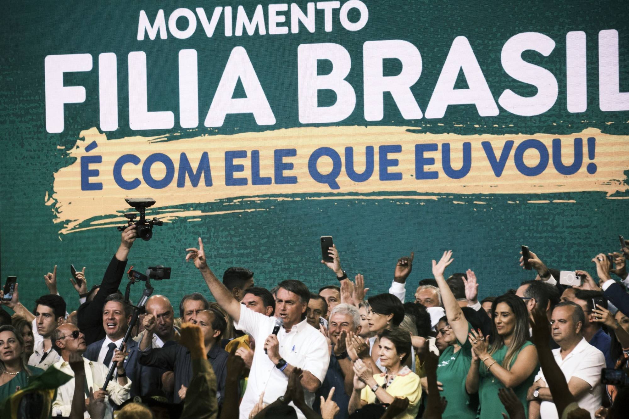 Jair Bolsonaro, Brazil's president (center), speaks during a re-election campaign event in Brasilia on March 27. | Bloomberg