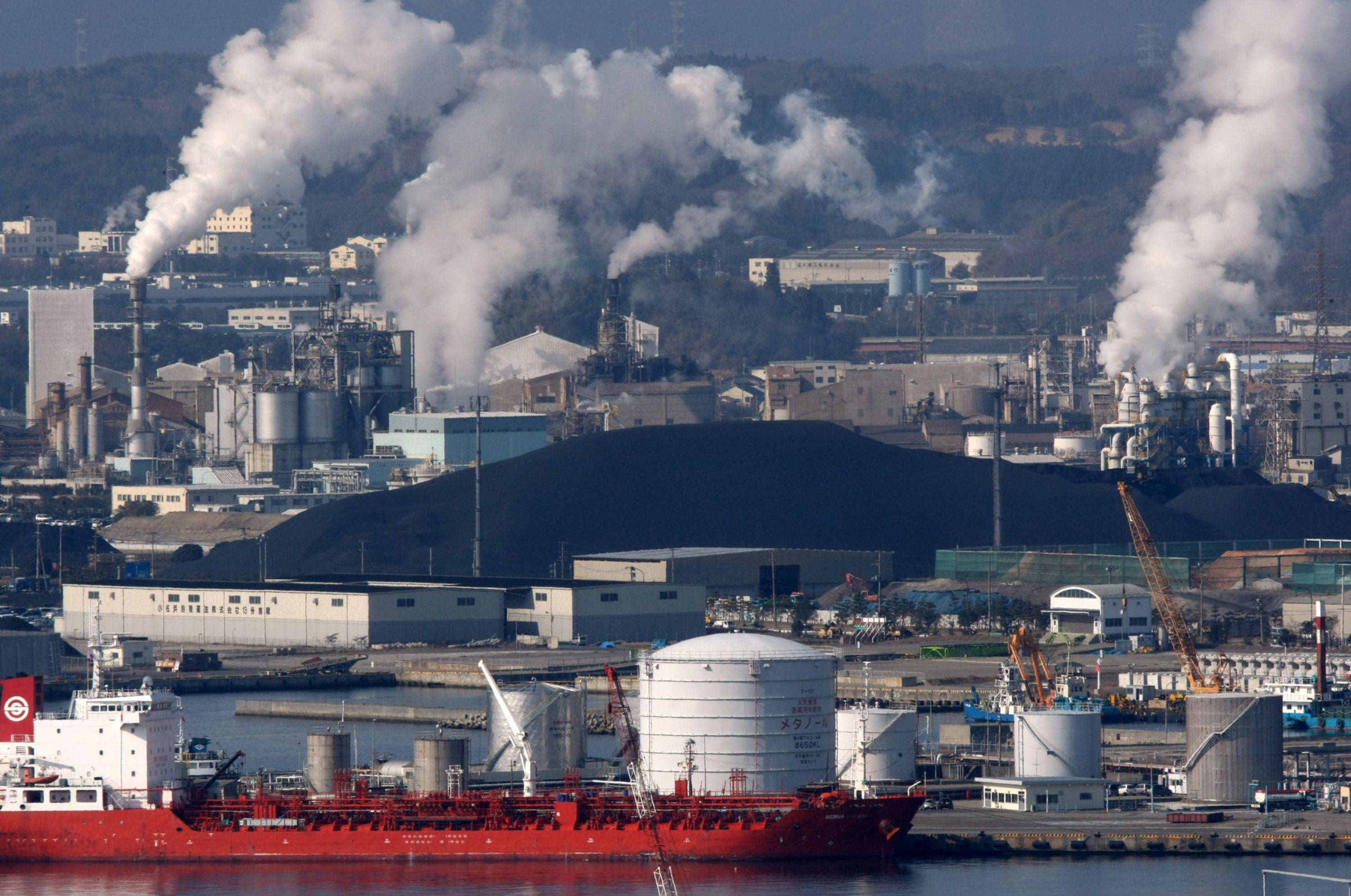 Imported coal is stockpiled after being offloaded at a port in the city of Iwaki, Fukushima Prefecture. | Bloomberg