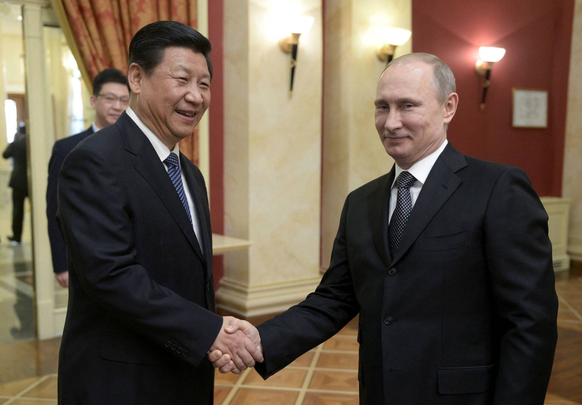 Chinese and Russian ties are a friendship of convenience, and the two nations can only really come together when facing a common enemy such as the West. |  RIA NOVOSTI / KREMLIN / VIA REUTERS