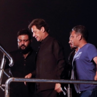 Former Pakistani Prime Minister Imran Khan arrives to address his first public gathering after being ousted from the parliament, in Peshawar, Pakistan, on Wednesday. | REUTERS