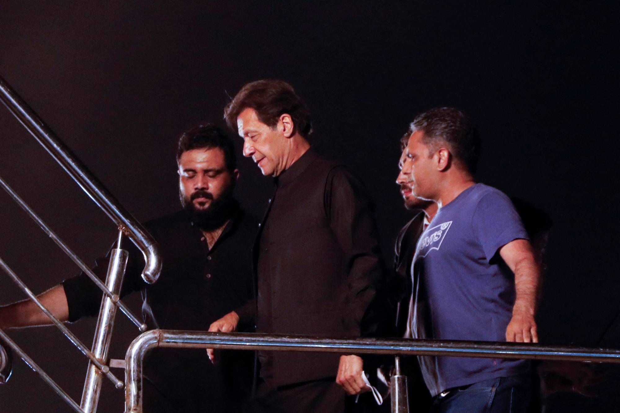 Former Pakistani Prime Minister Imran Khan arrives to address his first public gathering after being ousted from the parliament, in Peshawar, Pakistan, on Wednesday. | Reuters
