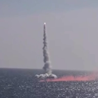 A Russian Kalibr cruise missile is test-fired from a submarine in the Sea of Japan in this image taken from video posted to Facebook by the country\'s Defense Ministry on Thursday. | REUTERS