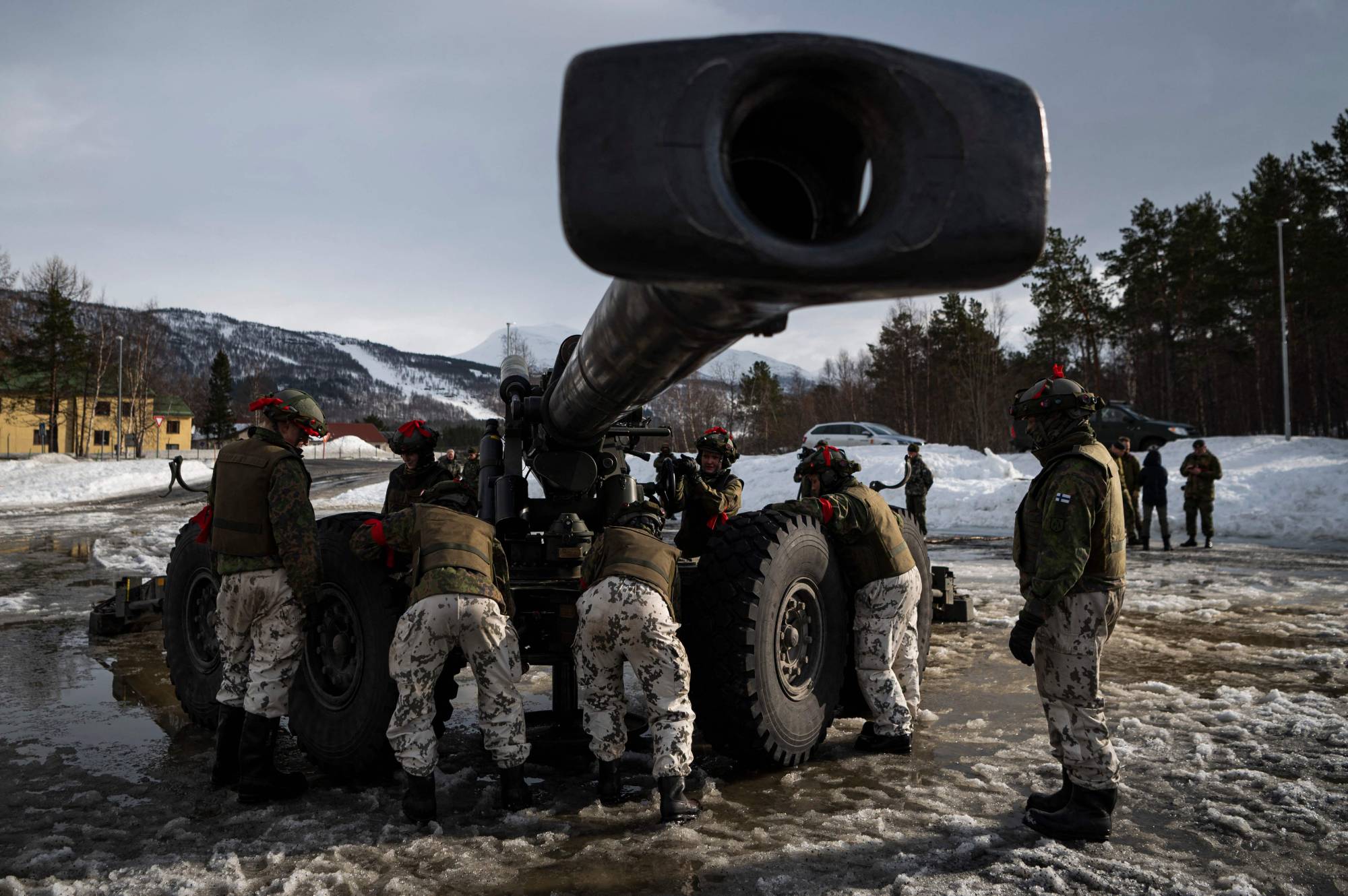Soldiers from the Finnish Defense Forces operate the Tampella 155 K 83-97, a towed 155 mm field gun, during an international exercise in Setermoen, Norway, on March 22. | AFP-JIJI