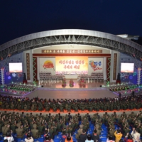 A performance by art circle members celebrating the 110th anniversary of the birth of the late North Korean leader Kim Il Sung at the Pyongyang Youth Park Open Air Theater in Pyongyang on Wednesday | KCNA / KNS / VIA AFP-JIJI

