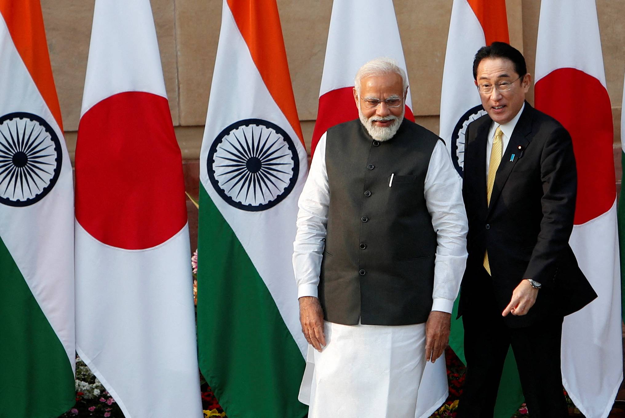 Indian Prime Minister Narendra Modi welcomes Prime Minister Fumio Kishida ahead of their meeting in New Delhi on March 19 where the two discussed the Ukraine conflict and decried the use of force to resolve international disputes.   | REUTERS 