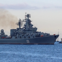 The Russian Navy\'s guided missile cruiser Moskva sails back into a harbor after tracking NATO warships in the Black Sea, in the port of Sevastopol, Crimea, in 2021. | REUTERS
