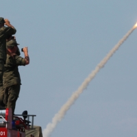 Russian servicemen watch the launch of the S-300 air defence system missile launch during the International Army Games 2016 at the Ashuluk military polygon outside Astrakhan, Russia. | REUTERS