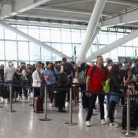 Lines formed at Heathrow Airport’s Terminal 5 in advance of the Easter holiday as the number of travelers surged. | HANNAH MCKAY / REUTERS