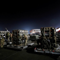 Ukrainian service members unpack Javelin anti-tank missiles, delivered by plane as part of the U.S. military support package for Ukraine, in Kyiv on Feb. 10.  | REUTERS