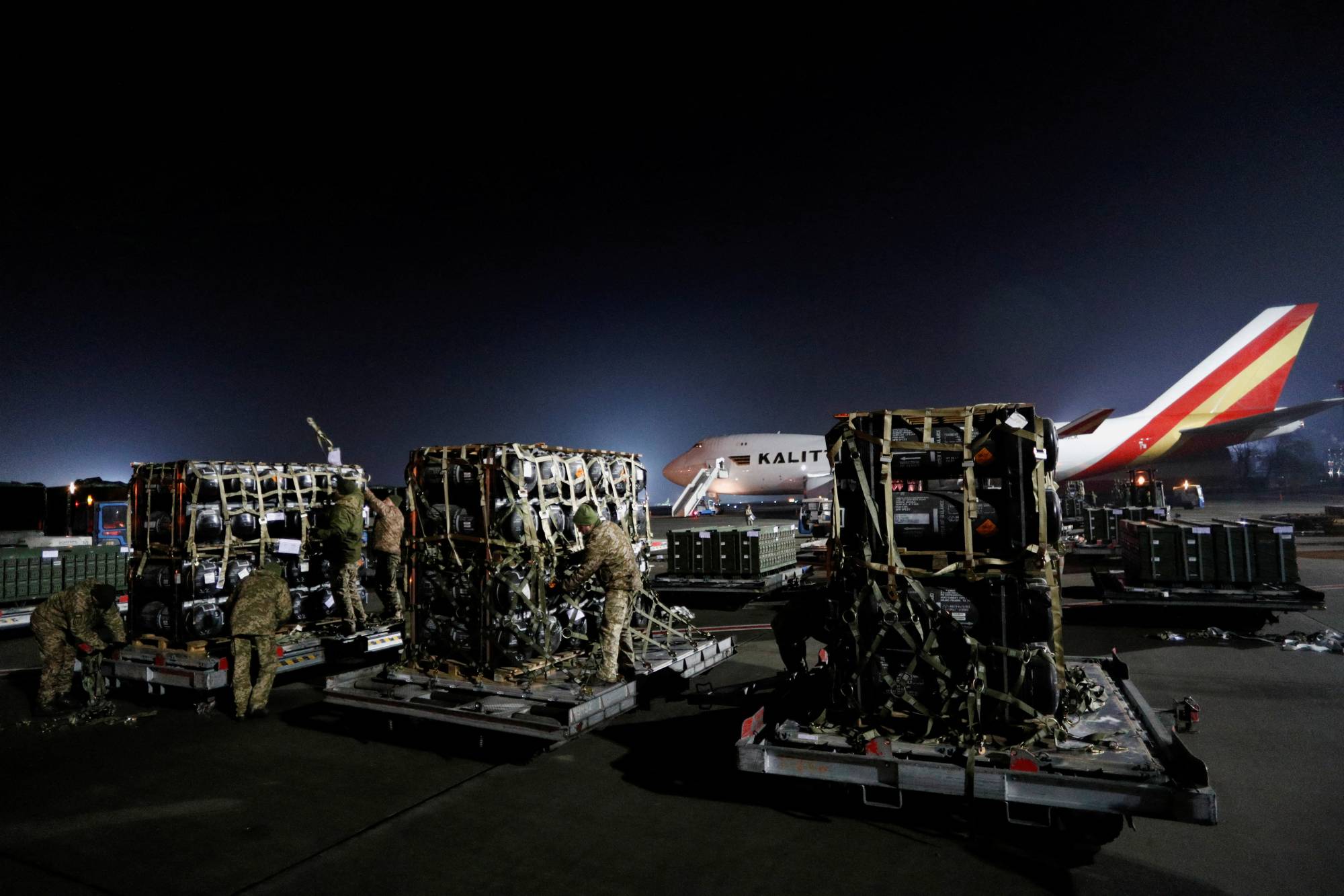 Ukrainian service members unpack Javelin anti-tank missiles, delivered by plane as part of the U.S. military support package for Ukraine, in Kyiv on Feb. 10.  | REUTERS