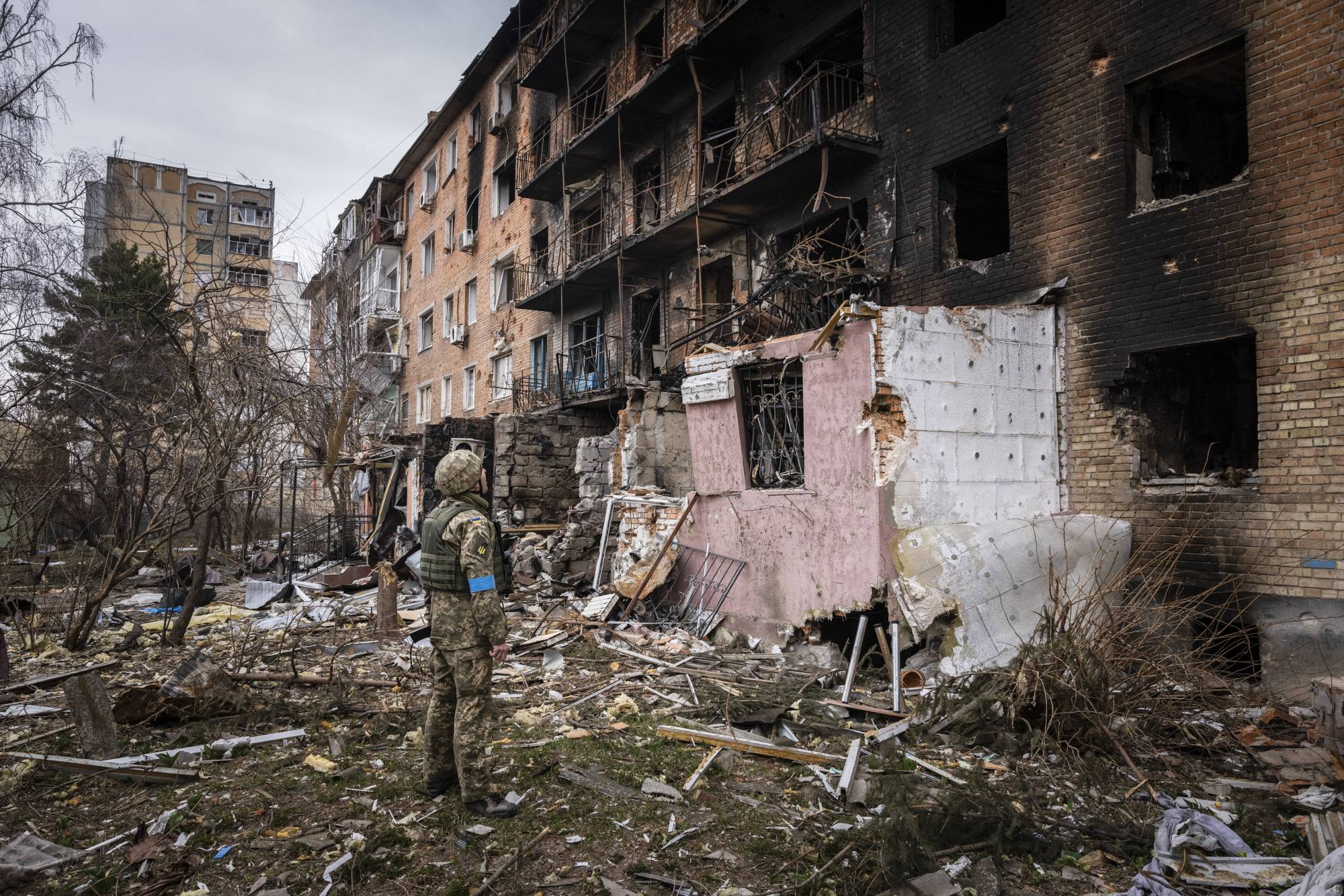 An apartment building that was destroyed by Russian missiles in the first days of the invasion in Vasylkiv, Ukraine, on March 30. | Ivor Prickett / The New York Times