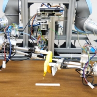 A dual-armed robot picks up a banana and peels it without squashing the fruit inside during a demonstration on Dec. 2 in Tokyo. | ISI (KUNIYOSHI) LAB., SCHOOL OF INFO. SCI & TECH., THE UNIVERSITY OF TOKYO / VIA REUTERS
