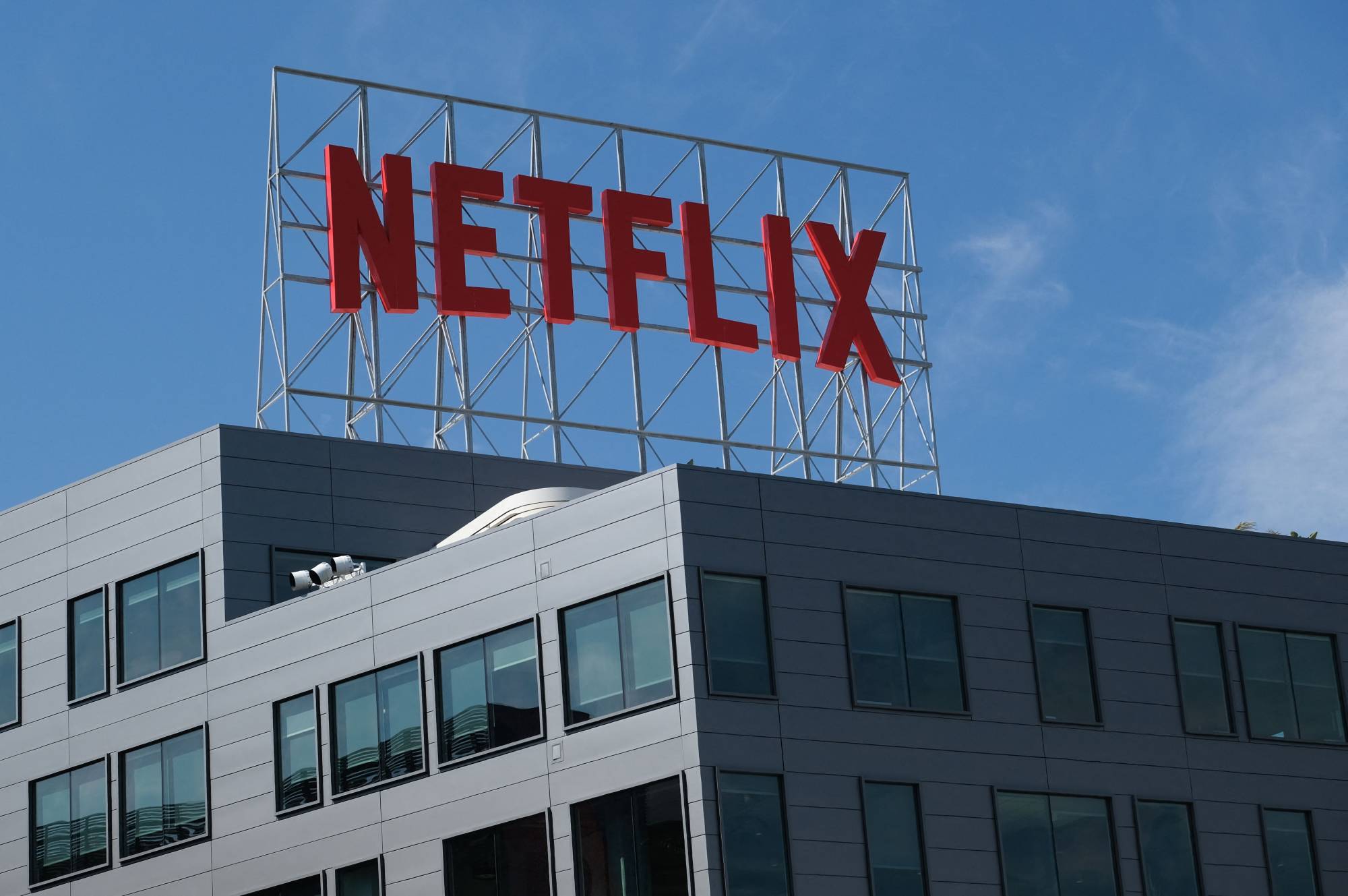 The Netflix logo displayed on top of the firm's offices in Hollywood, California. Netflix is seeking ways to stop a loss of subscribers and combat investor fears that its best days are over. | AFP-JIJI