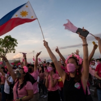 Supporters of Leni Robredo, Philippine vice president, cheer during a campaign rally in San Fernando City, Pampanga Province, the Philippines, on April 9. | REUTERS