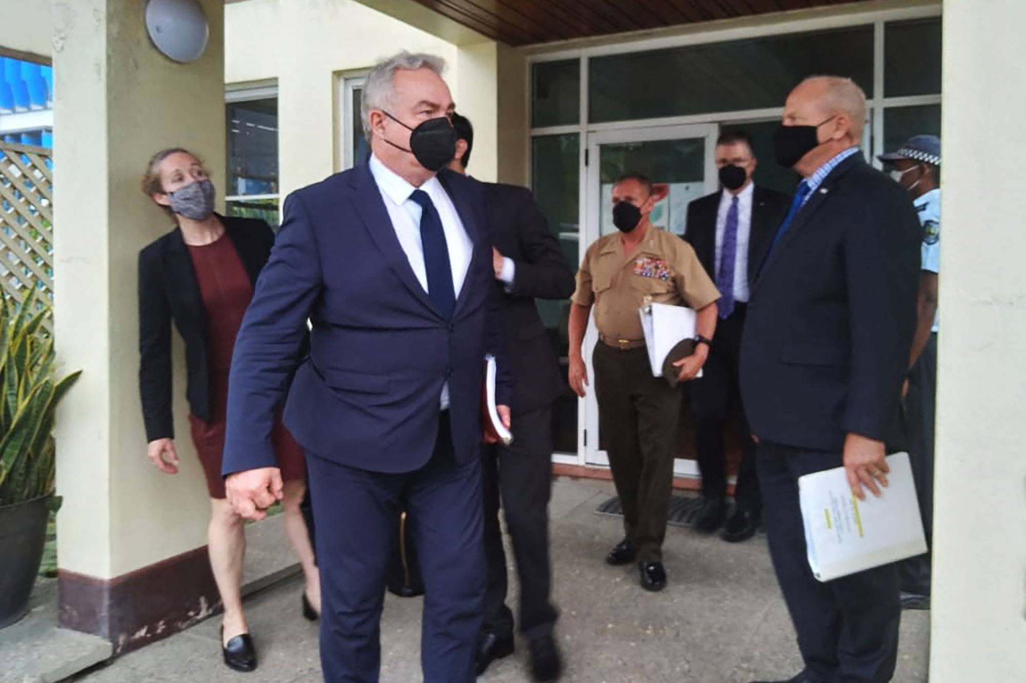 U.S. Indo-Pacific coordinator Kurt Campbell (center) leaves after a meeting with the Solomon Islands government in Honiara on Friday. | AFP-JIJI