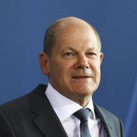 German Chancellor Olaf Scholz speaks to reporters in Berlin on Tuesday. | AP / VIA KYODO