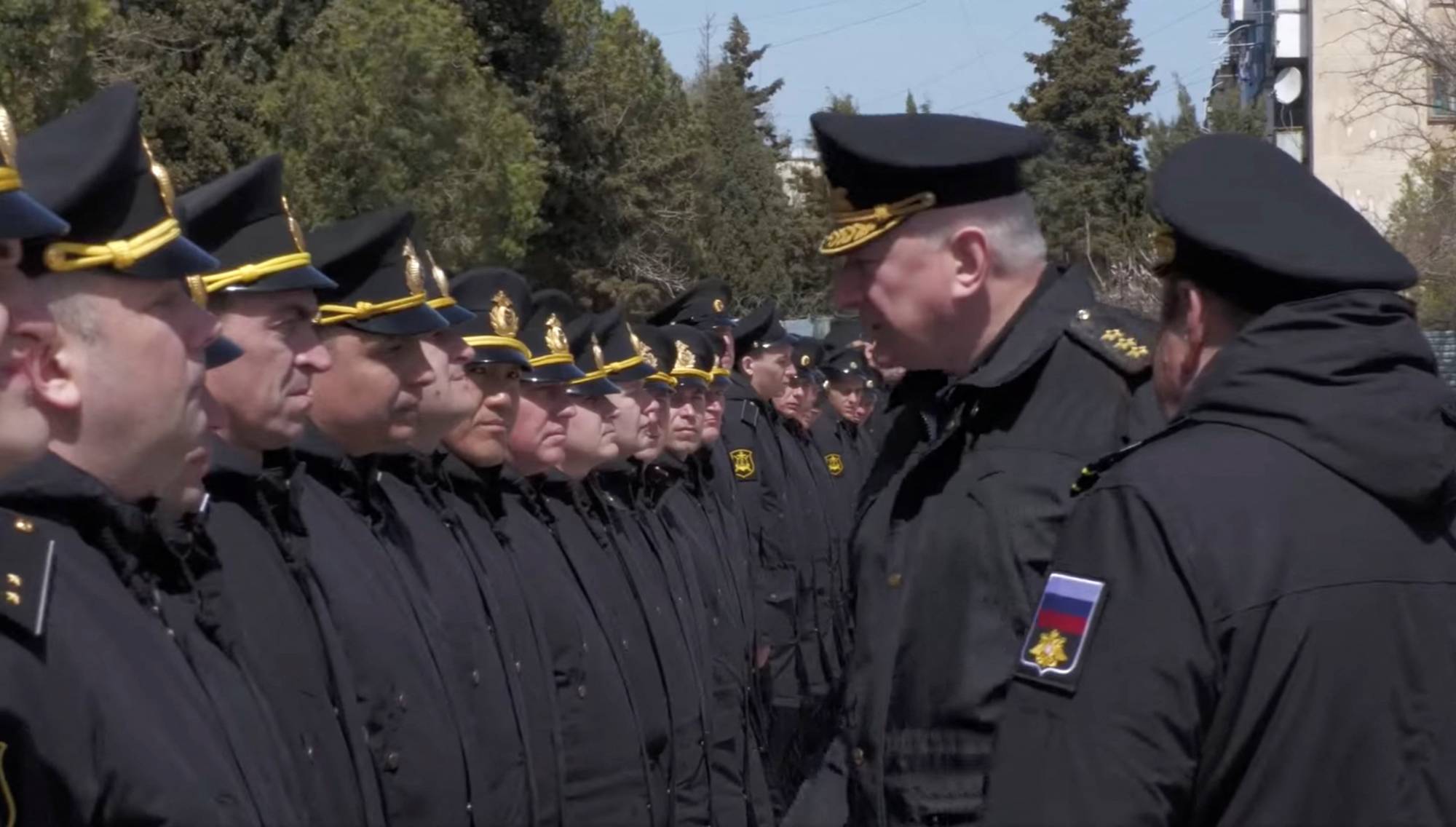 The head of the Russian navy, Adm. Nikolai Yevmenov, meets with people said to be crew members from the sunken Moskva in Sevastopol, Crimea, on April 16. | Russian Defense Ministry / via REUTERS