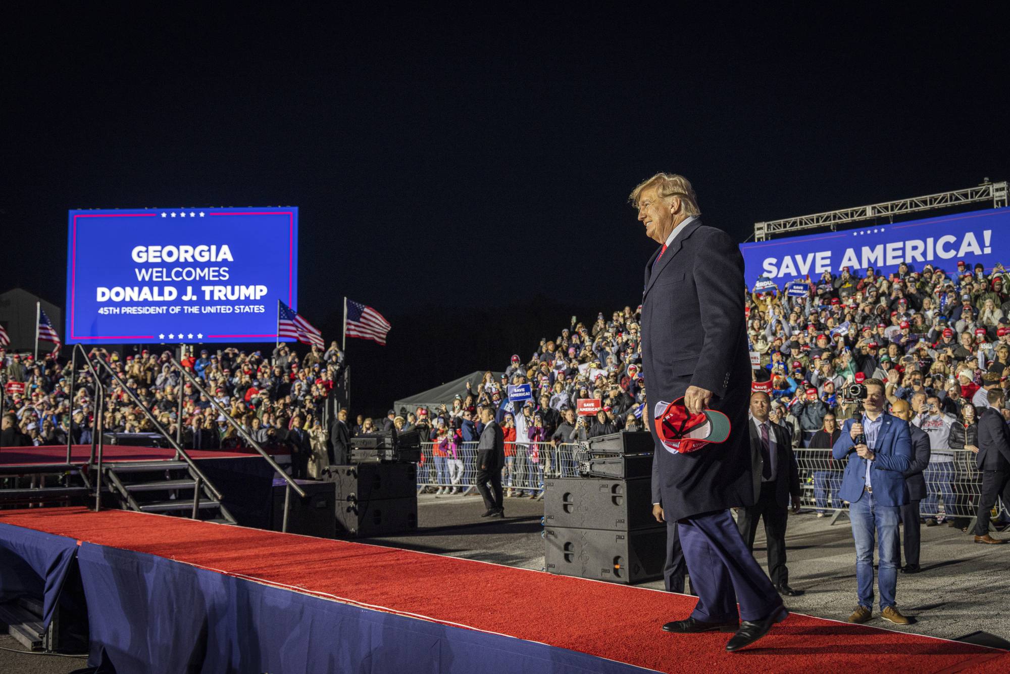 Former U.S. President Donald Trump appears at a rally in Commerce, Georgia, on March 26.  | AUDRA MELTON / THE NEW YORK TIMES
