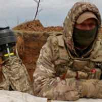 A Ukrainian serviceman with a U.S.-made and supplied Javelin anti-tank missile | REUTERS