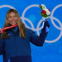 American Chloe Kim celebrates after winning gold in the women\'s snowboard halfpipe at the Beijing Olympics in Zhangjiakou, China, on Feb. 10. | REUTERS