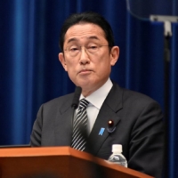Prime Minister Fumio Kishida attends a news conference in Tokyo on Tuesday. | POOL / VIA REUTERS