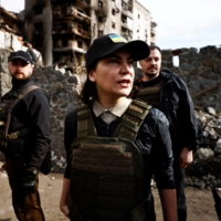 Ukrainian Prosecutor General Iryna Venediktova talks to journalists, beside buildings that were destroyed by Russian shelling, during a visit to Borodyanka, in the Kyiv region, on April 7. | REUTERS 