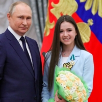 Russian President Vladimir Putin poses with figure skater Kamila Valieva during an awards ceremony for Beijing 2022 medalists at the Kremlin in Moscow on Tuesday. | AFP-JIJI