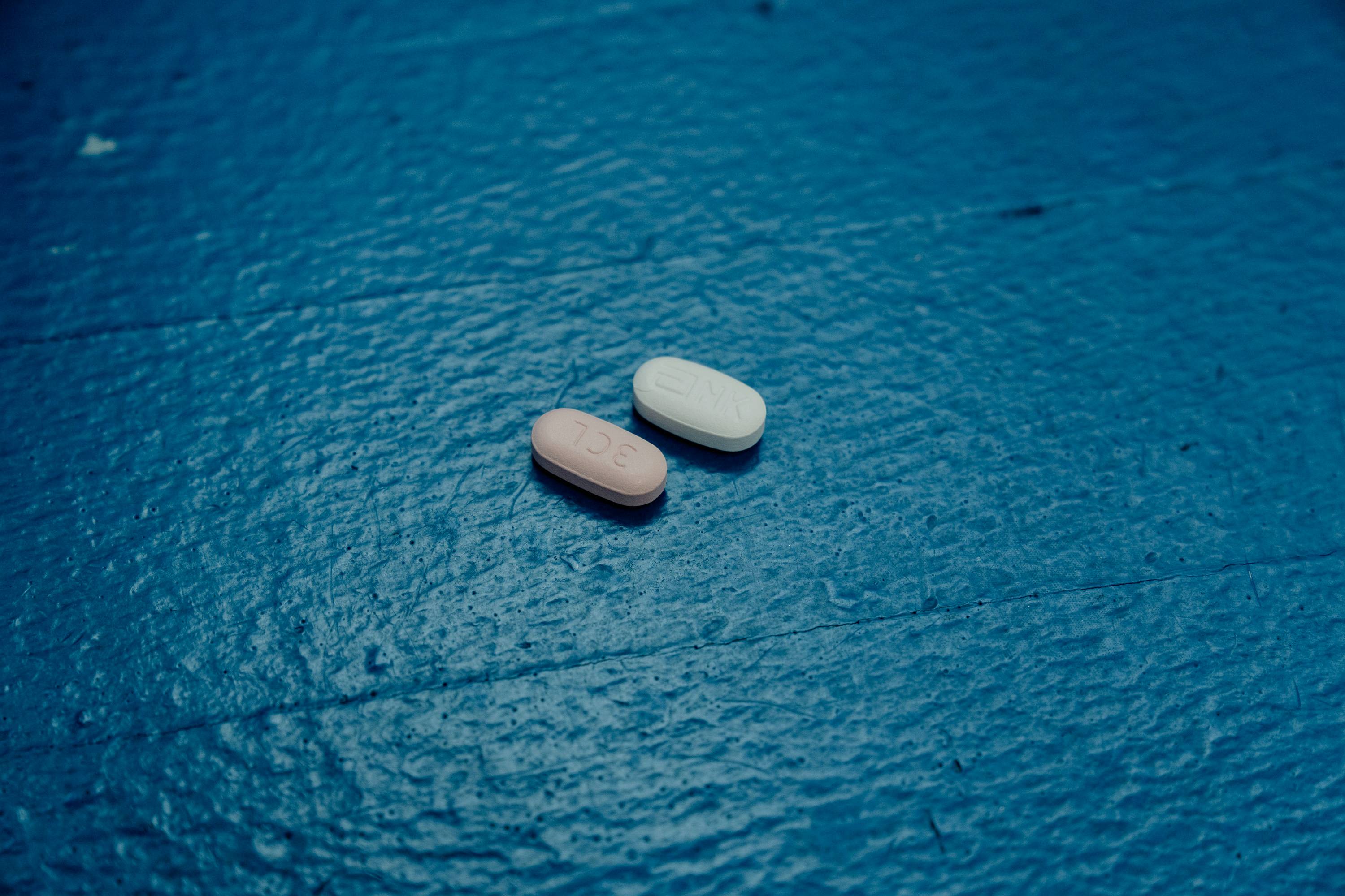 Two pills used in the Paxlovid anti-viral treatment, at Demmy’s Pharmacy in Greenbelt, Maryland | Shuran Huang / The New York Times