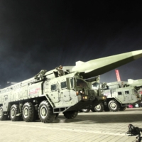 North Korean military vehicles carrying what some observers say are hypersonic glide vehicles are seen during a nighttime military parade to mark the 90th anniversary of the founding of the Korean People\'s Revolutionary Army in Pyongyang in this undated photo released Tuesday.  | KCNA / VIA REUTERS   