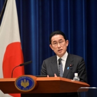Prime Minister Fumio Kishida speaks during a news conference in Tokyo on Tuesday.  | POOL / VIA REUTERS