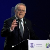 Australian Prime Minister Scott Morrison makes a statement at a U.N. climate change conference in Glasgow, Scotland, on Nov. 1.  Morrison’s conservative government is trailing in polls ahead of a May 21 election, a slump that started around February last year when former staffer Brittany Higgins alleged that she was raped in Parliament House. | POOL / VIA REUTERS