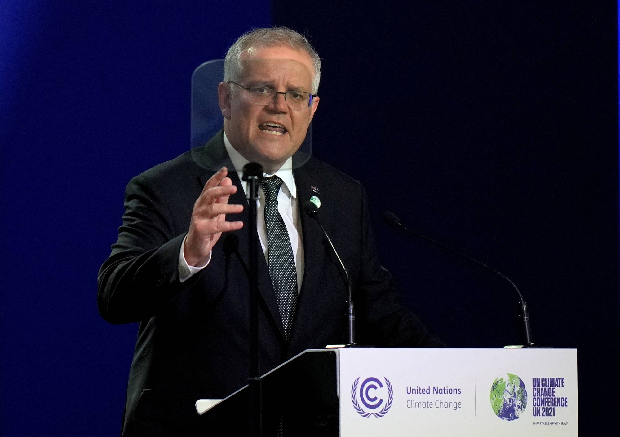 Australian Prime Minister Scott Morrison makes a statement at a U.N. climate change conference in Glasgow, Scotland, on Nov. 1. Morrison’s conservative government is trailing in polls ahead of a May 21 election, a slump that started around February last year when former staffer Brittany Higgins alleged that she was raped in Parliament House. | Pool / via REUTERS