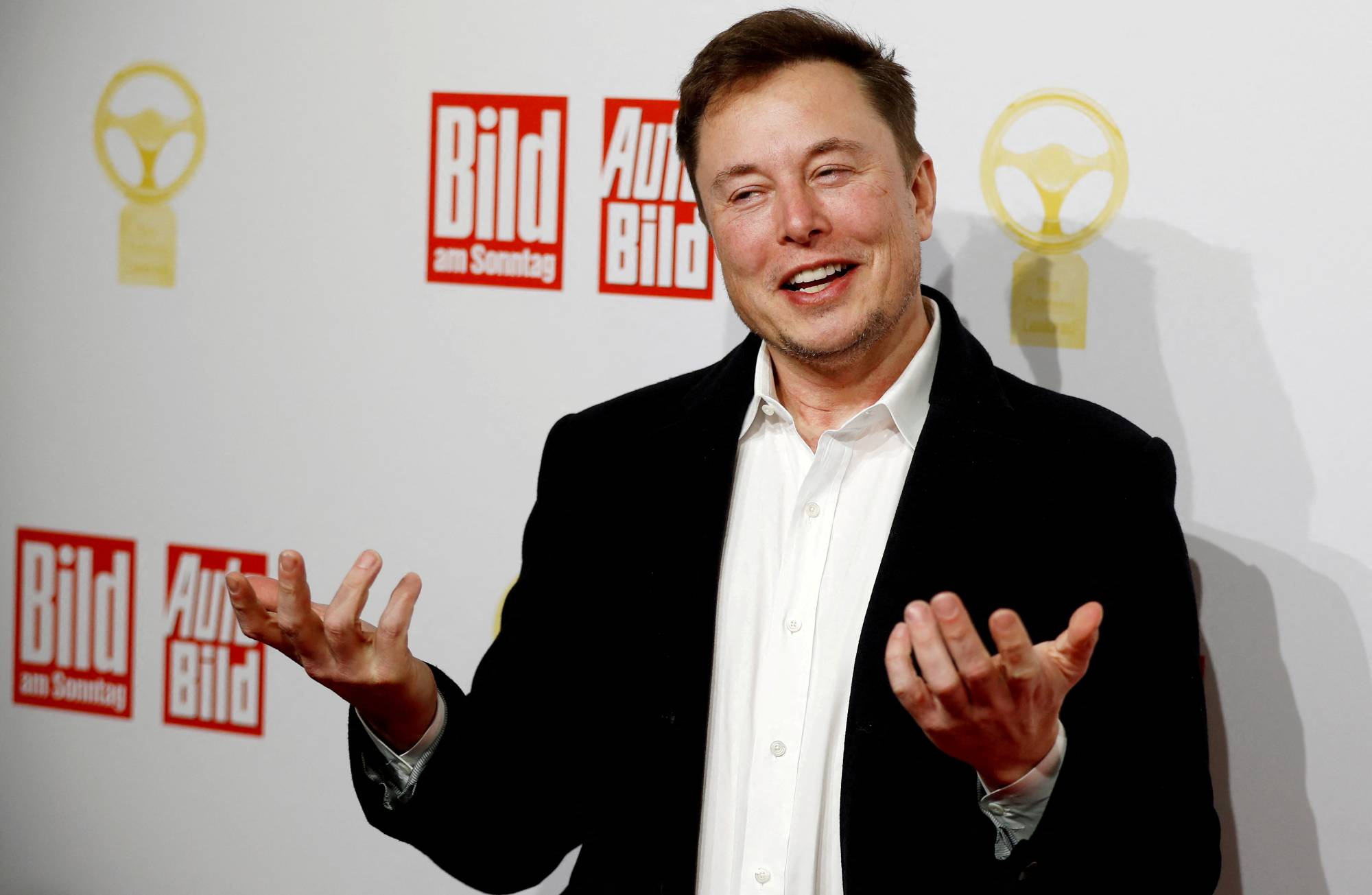 Tesla CEO Elon Musk arrives on the red carpet for an award ceremony in Berlin on Nov. 12, 2019. On Monday, hours after the buyout announcement, employees at a companywide meeting complained about Musk's 'questionable ethics' and wondered what would happen to Twitter's work limiting hate speech on its platform. | REUTERS