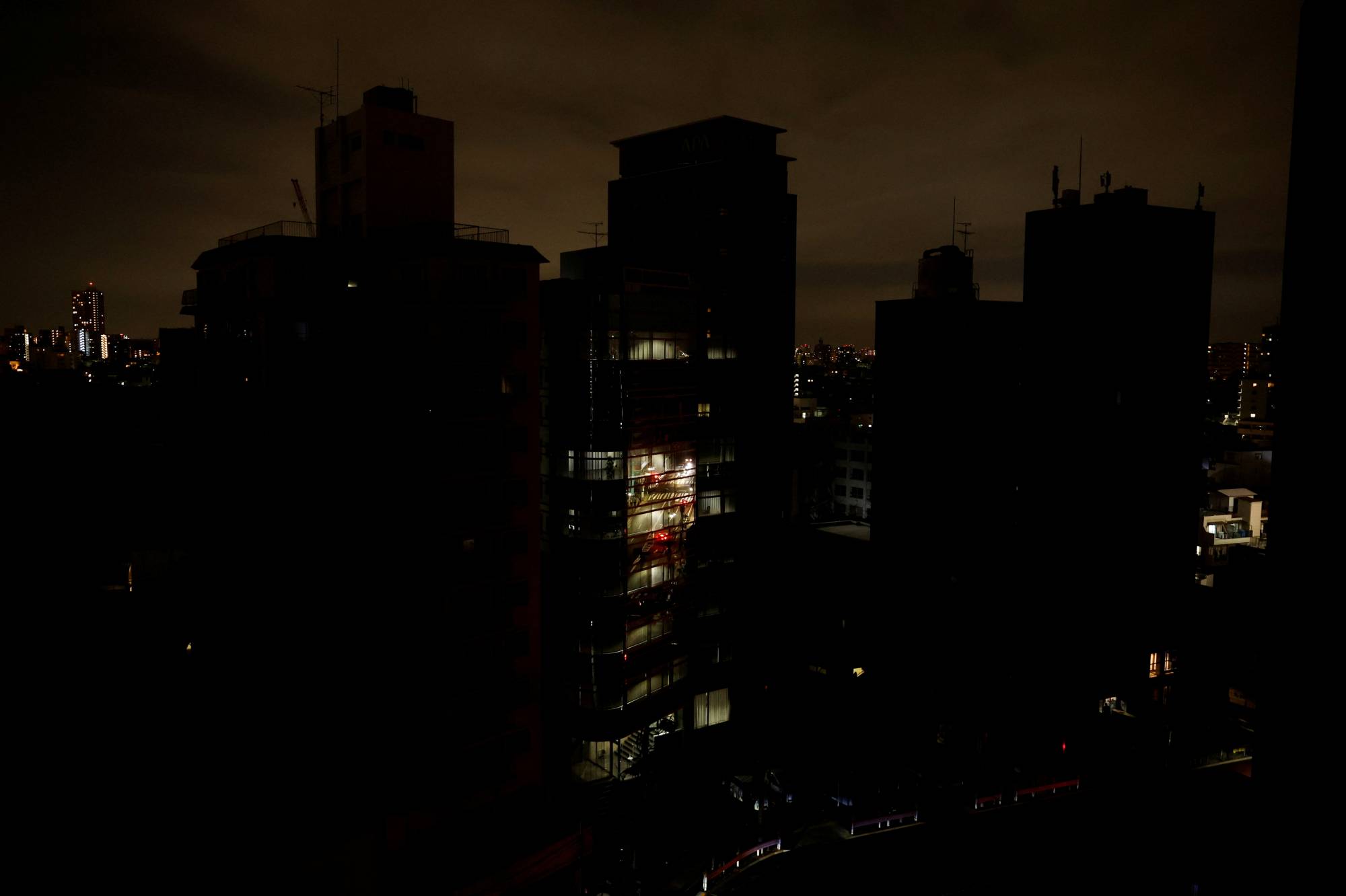 Houses and buildings in Tokyo's Toshima Ward on March 17 during an electricity stoppage after an earthquake | REUTERS