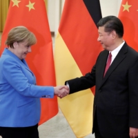 Chinese leader Xi Jinping meets then-Chancellor Angela Merkel of Germany at the Great Hall of the People in Beijing in 2018. | POOL / VIA REUTERS 