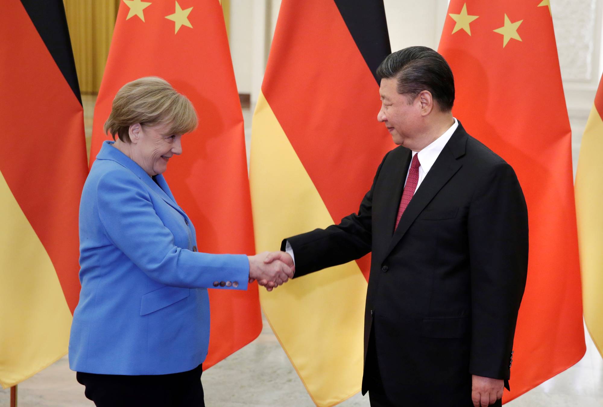 Chinese leader Xi Jinping meets then-Chancellor Angela Merkel of Germany at the Great Hall of the People in Beijing in 2018. | POOL / VIA REUTERS 