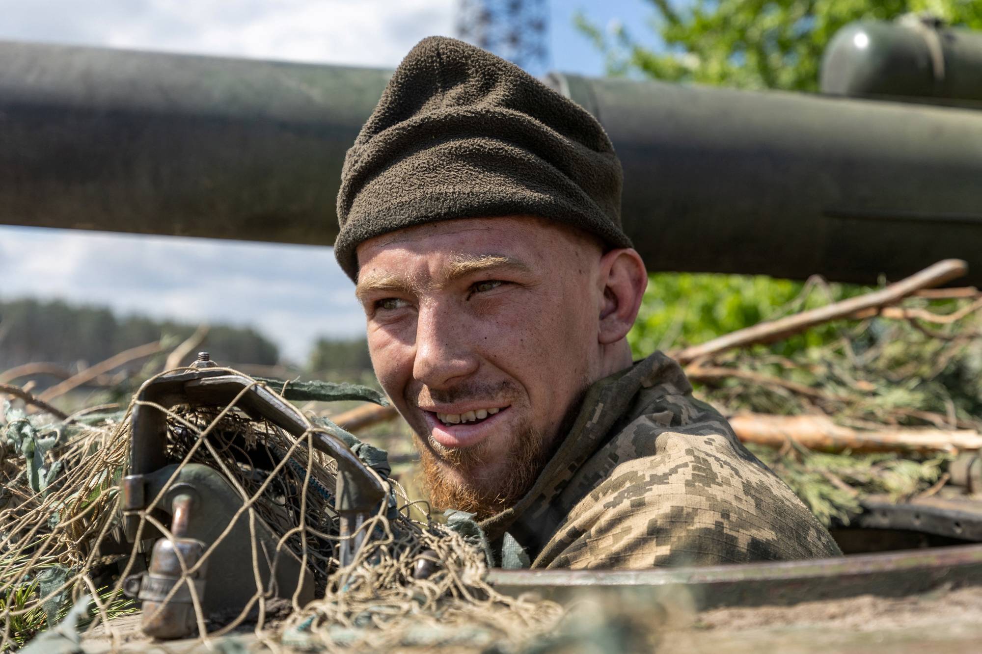 A Ukrainian soldier rides in a tank in the frontline city of Lyman, in Ukraine's Donetsk region, on Thursday. | Reuters 