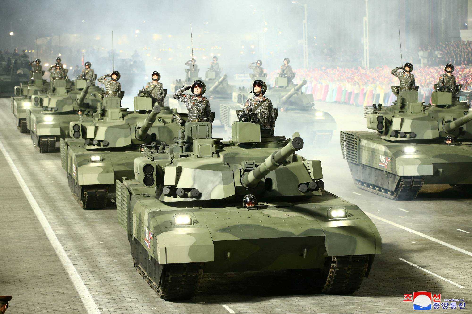 Troops in armored vehicles participate in a military parade in Pyongyang in this undated photo released on April 26. | KCNA / via REUTERS 