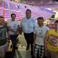 Hosts of the Grand Sumo Breakdown podcast pose with former yokozuna Kisenosato (center) at Aichi Prefectural Gymnasium during the Nagoya Basho in July 2019. | COURTESY OF GRAND SUMO BREAKDOWN