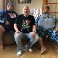 Israeli musican and sumo content creator Moti Dichne (center) poses with former yokozuna Musashimaru (left) and former ozeki Konishiki at Musashigawa stable in May 2019. | COURTESY OF MOTI DICHNE