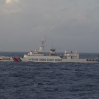 A China Coast Guard vessel sails near the Senkaku Islands in December 2015. | 11TH REGIONAL COAST GUARD HEADQUARTERS-JAPAN COAST GUARD / VIA REUTERS