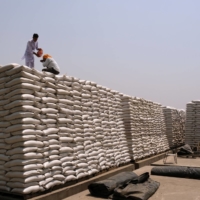 Wheat sacks at a Punjab Grains Procurement Corp. facility in the Ludhiana district of Punjab, India, on May 1. A  | BLOOMBERG