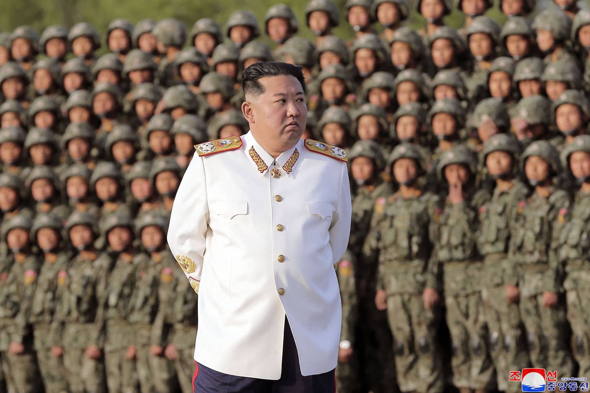 North Korean leader Kim Jong Un observes a military parade on April 27. | KCNA / KNS / VIA AFP-JIJI 